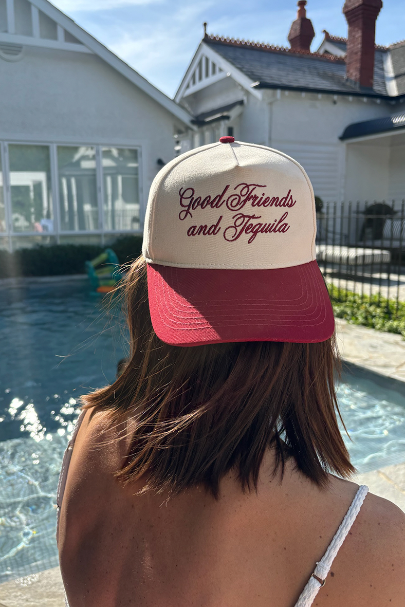 burgundy peak cap with cream body with burgundy embroidery saying good friends and tequila