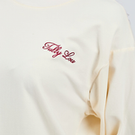 burgundy italic embroidery Tully Lou on long sleeve butter yellow cotton top