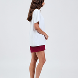 right hand side burgundy cotton shorts with white tee