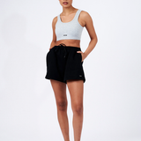 lounge shorts black with model with hands in the pocket styled with grey crop top