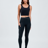 front view black wide waistband leggings with hand in invisible bonded pocket