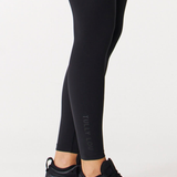 Tully lou logo on lower ankle of black workout leggings with high waisted core support 