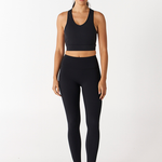 model with black compression active sports leggings with wide waistband full length black tights