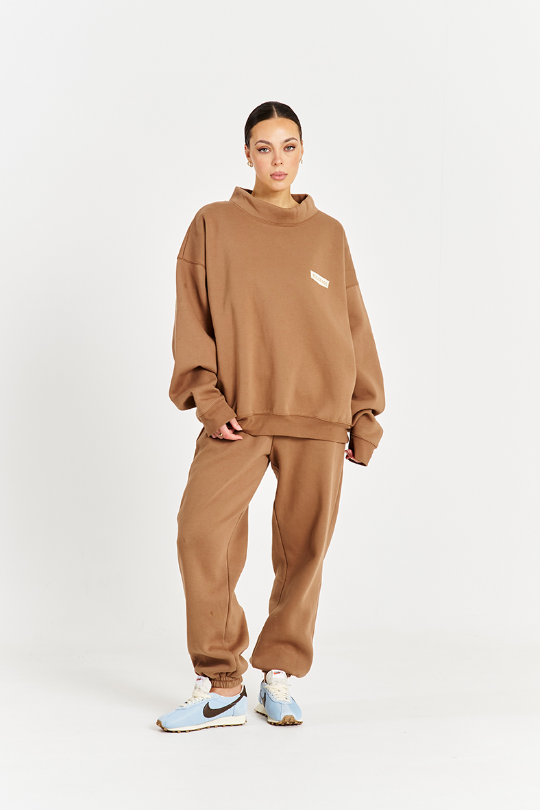 model front e come image wearing mocha brown jumper and matching trackpants