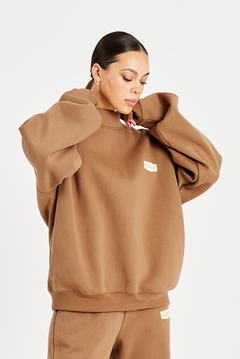 model close up of neck of mocha brown jumper 