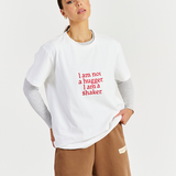 white heavy cotton tee layered with greay long sleeve and brown track pants 