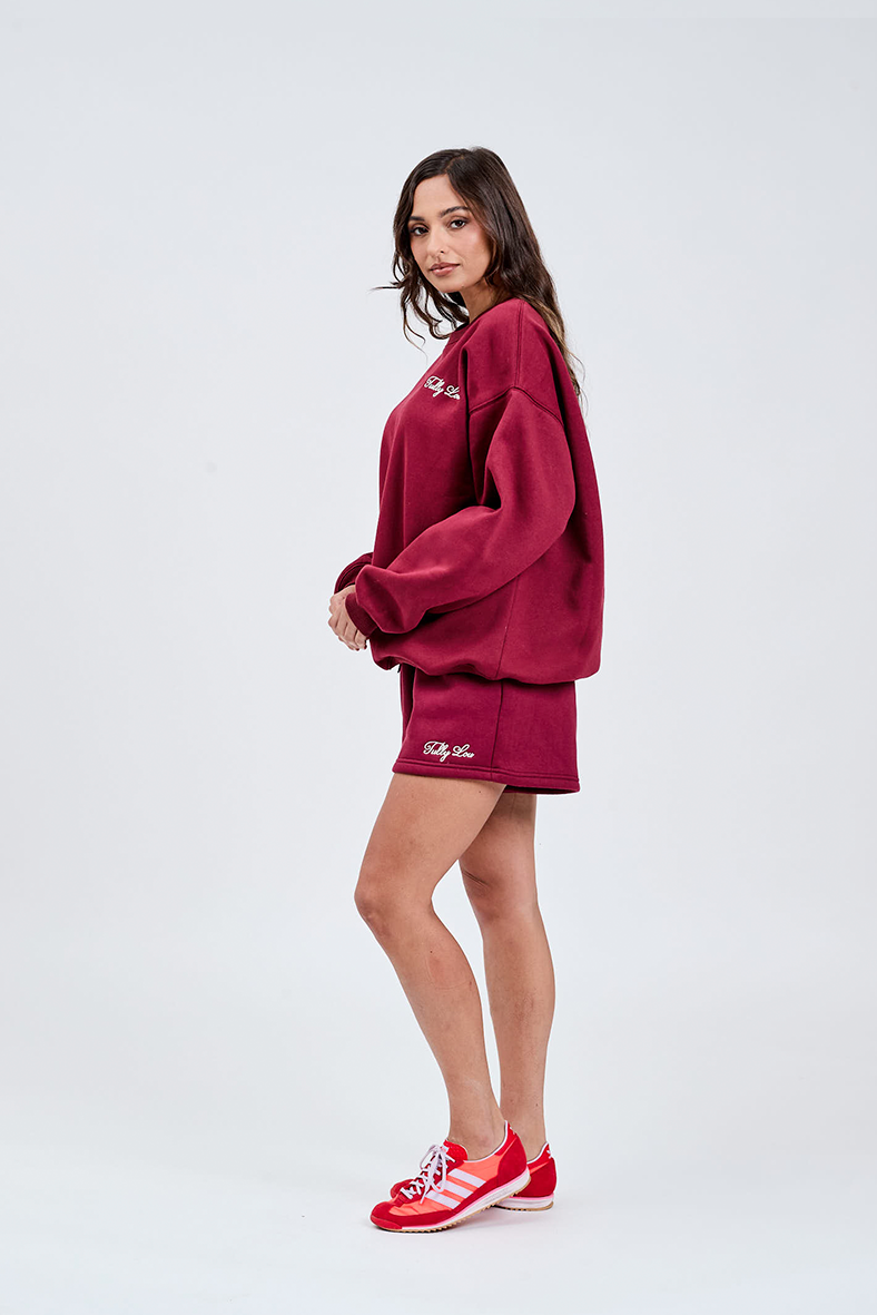 Burgundy sweater left hand side with Tully Lou italic embroidery left chest