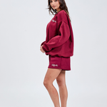 Burgundy sweater left hand side with Tully Lou italic embroidery left chest