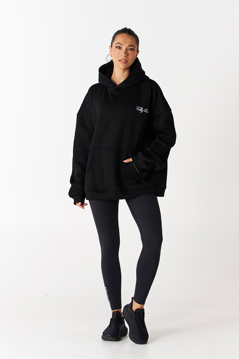 Black big boyfriend hoodie with pocket with white Tully Lou logo on front