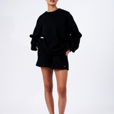 Black essentials lounge set shorts and sweater on model