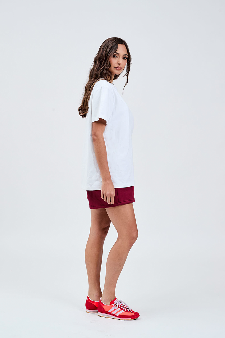 right side white cotton weight tee with burgundy shorts