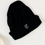 black beanie flat lay image with TL embroidered logo