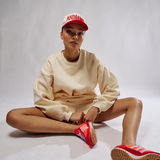 campaign image of tully lou andiamo hat red and cream with 3D printing 