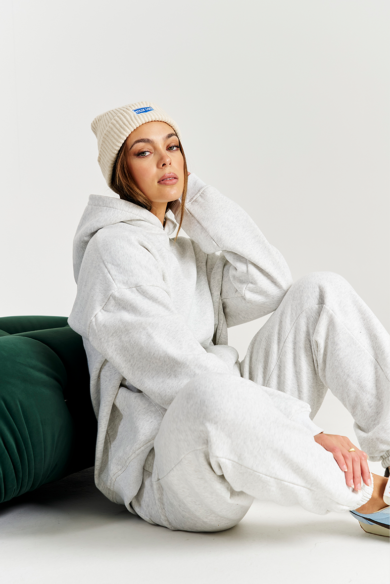 white beanie winter styled with matching set grey marle tracksuit