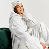 white beanie winter styled with matching set grey marle tracksuit